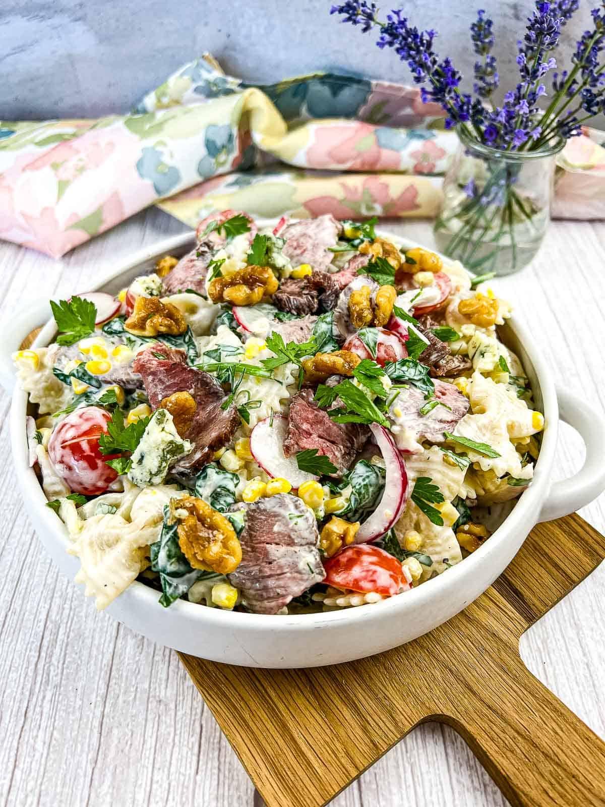 Close up of the steak and macaroni salad on a plate