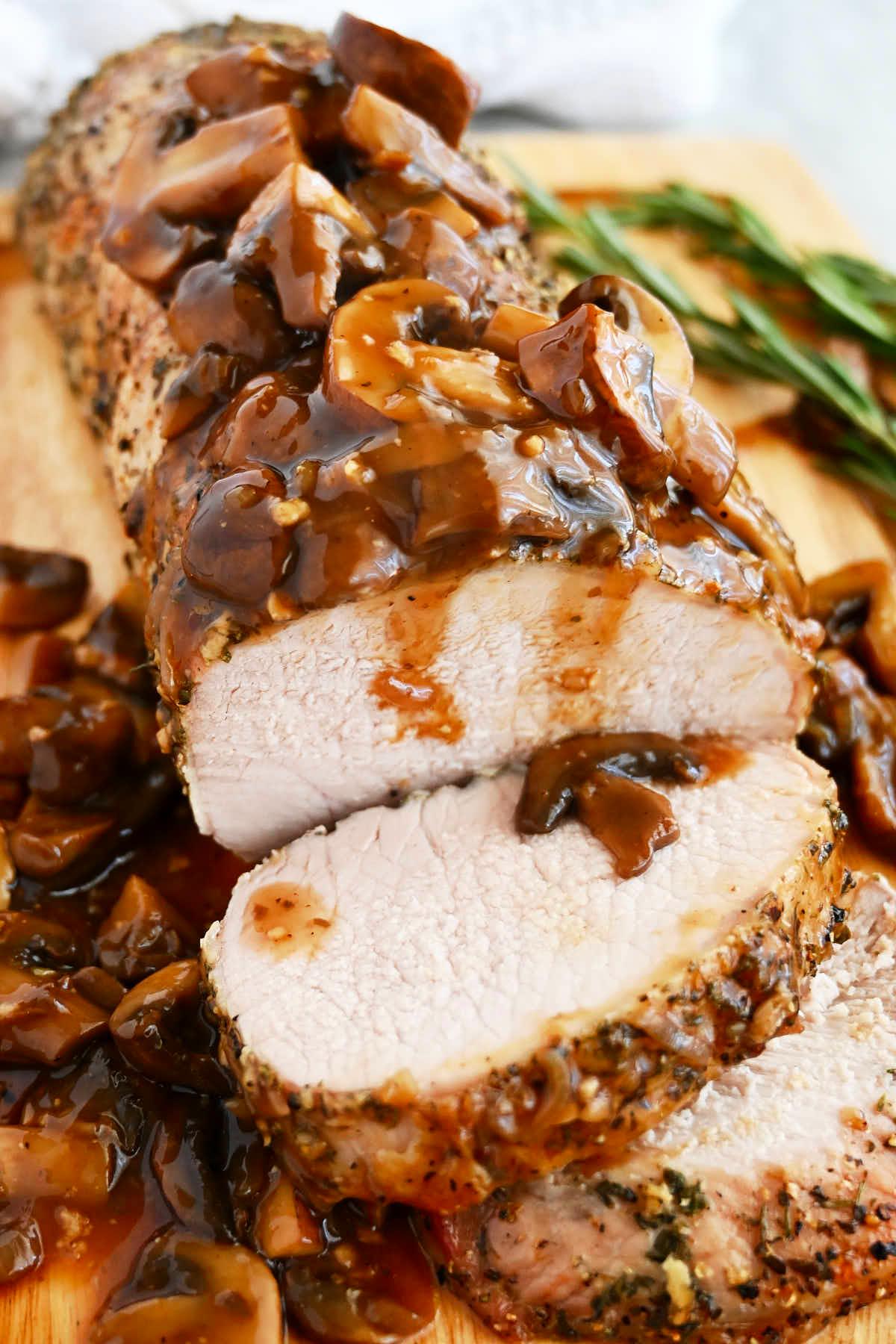 Juicy roasted pork loin with rich mushroom sauce