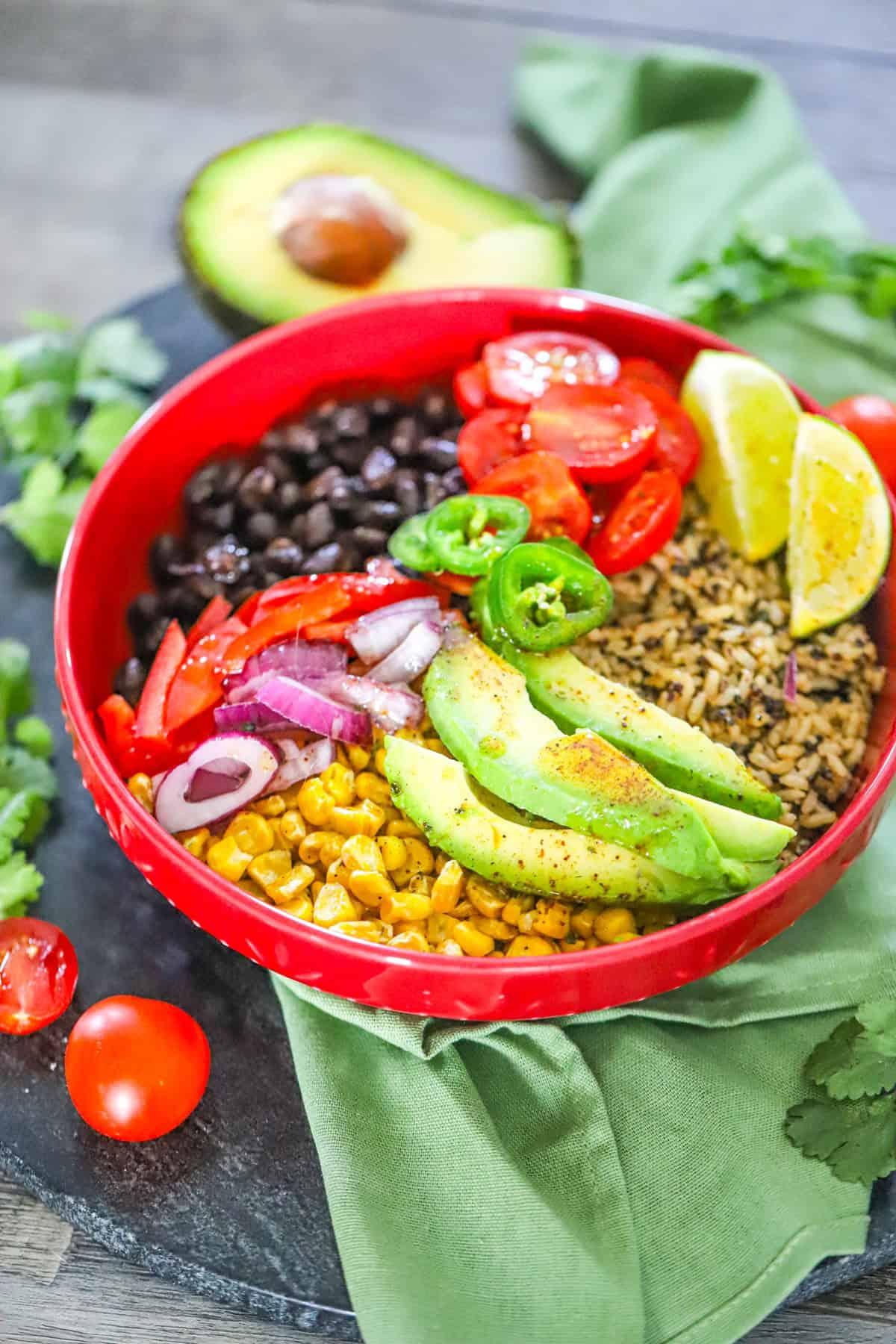 Vibrant Mexican Fiesta Quinoa Bowl with Chicken and Salsa, garnished with cilantro and lime wedges