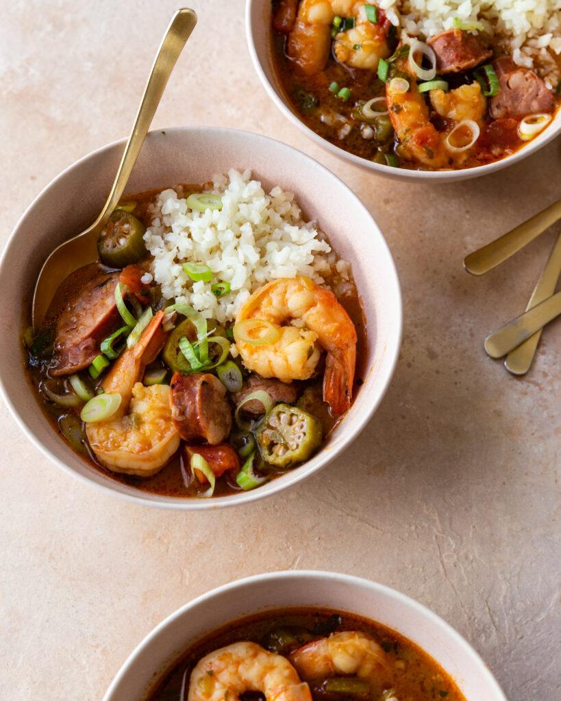 Close-up shot of spicy shrimp stew with andouille sausage in a bowl