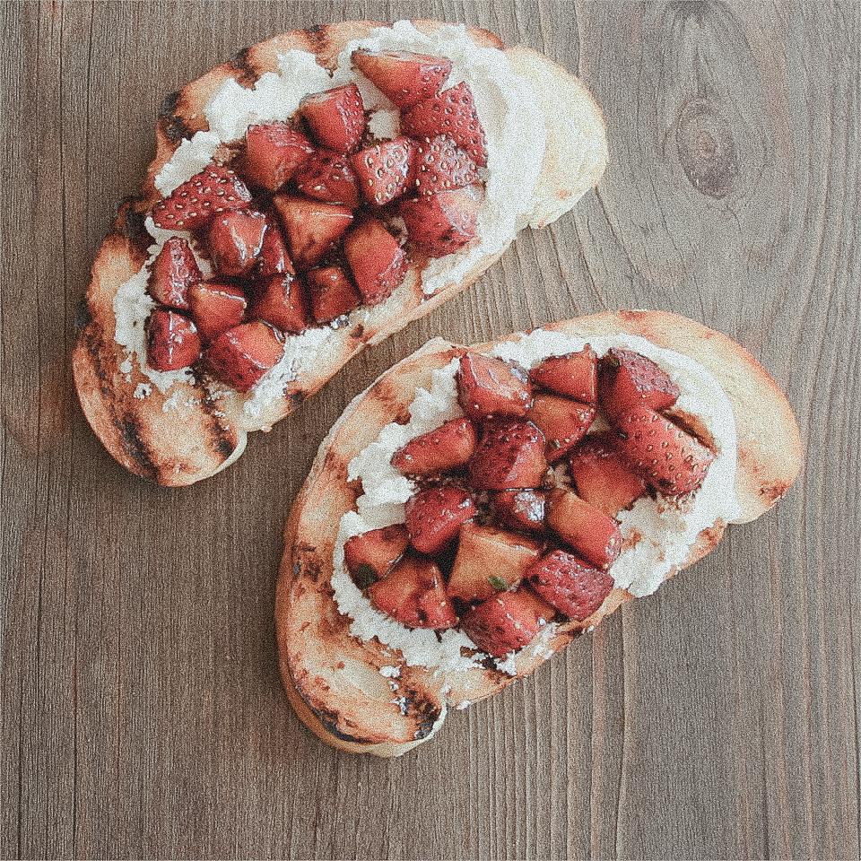 aerial view of a canyon with a picnic spread featuring a strawberry salad