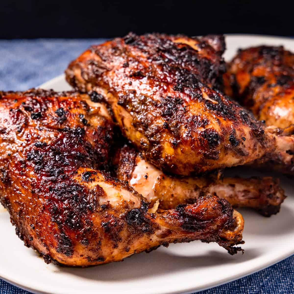 Close-up shot of delicious jerk chicken on a grill