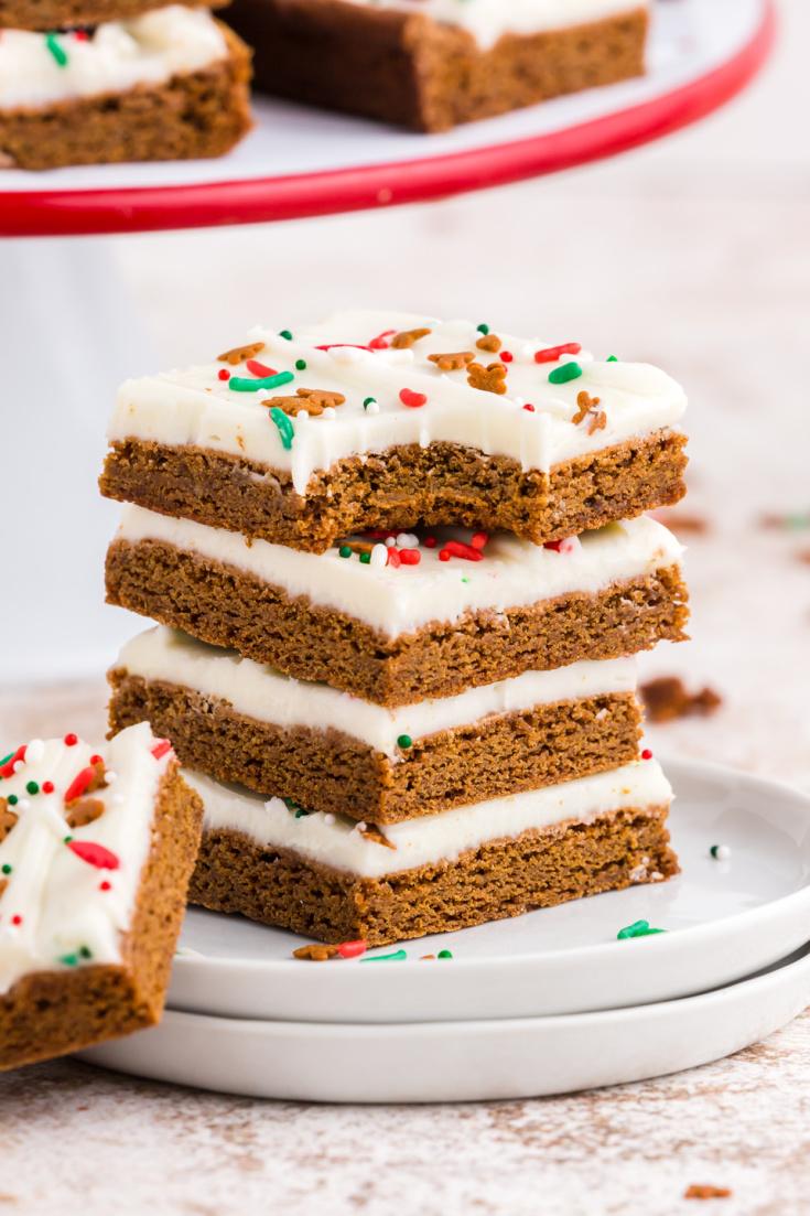 Someone taking a bite of a gingerbread bar