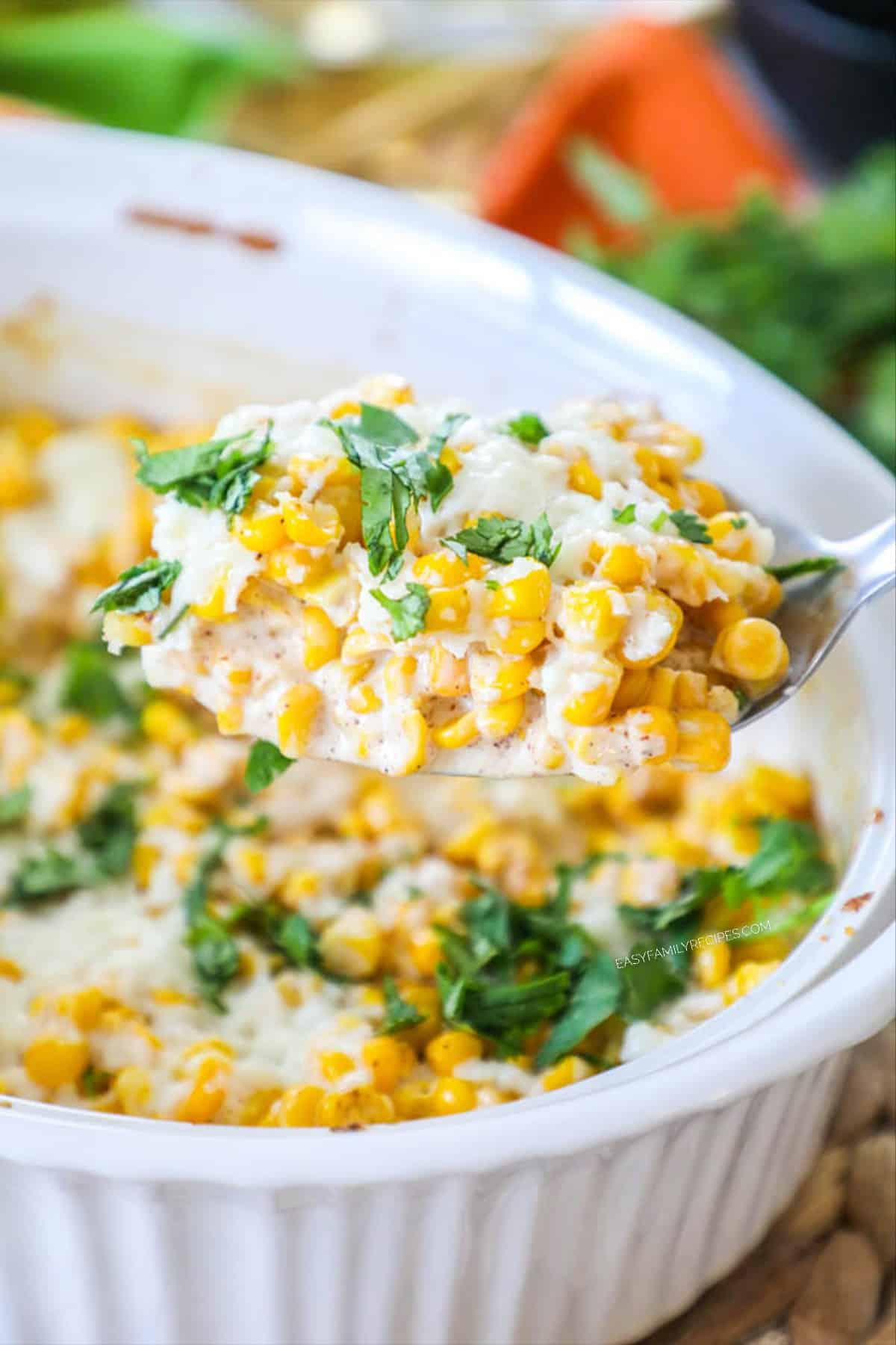 Happy family enjoying a meal with corn casserole as a side dish on a dining table