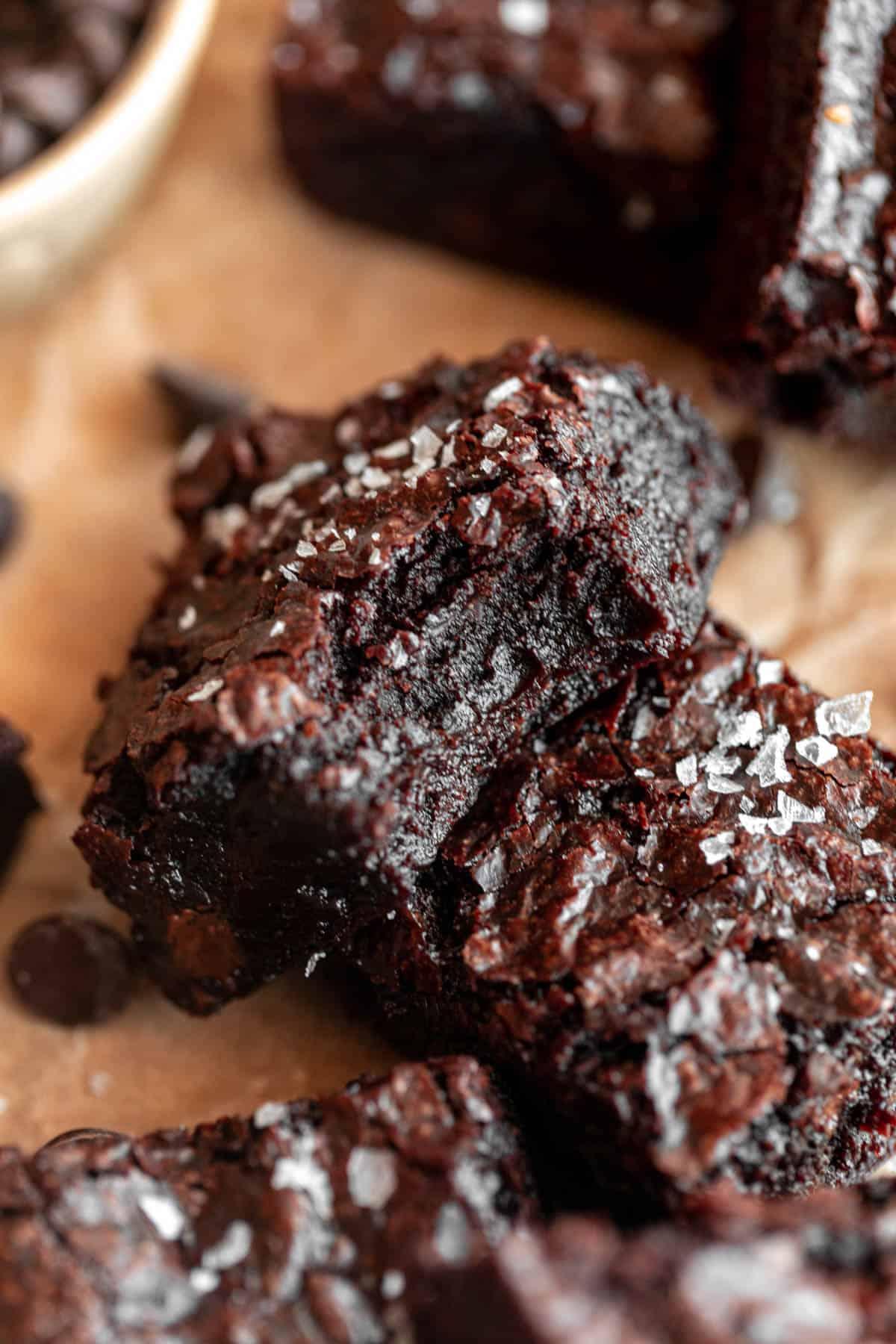 Close up shot of a brownie, gooey inside, with glossy glaze