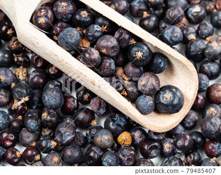 close-up of juniper berries and cardamom pods