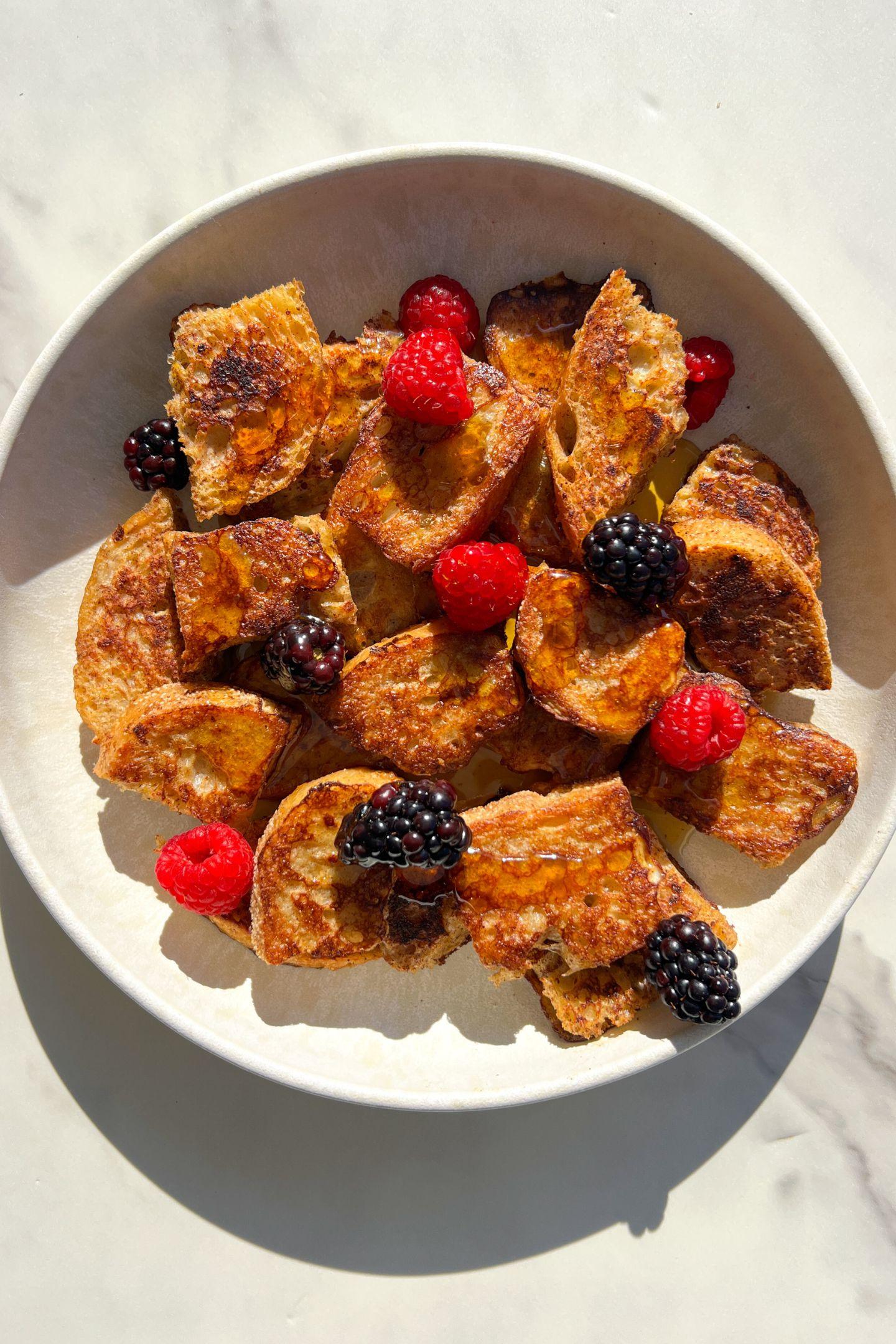 Golden brown, crispy French toast bites on a plate