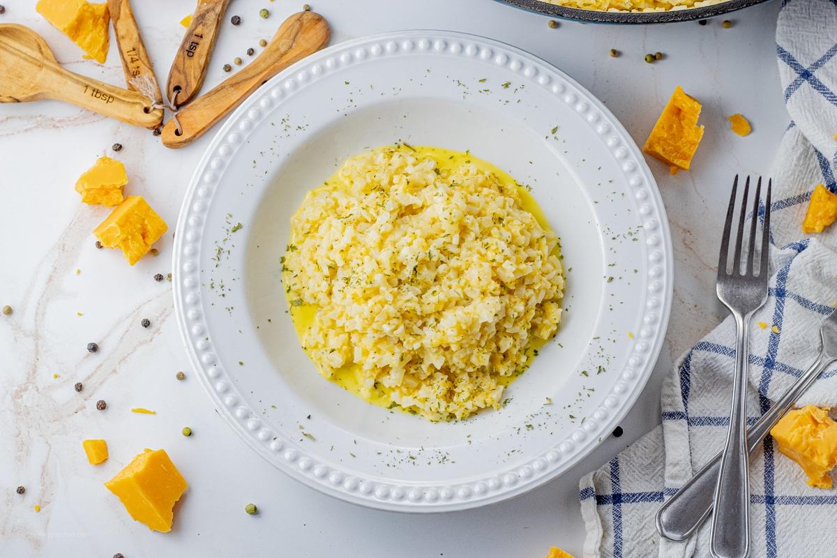 A bowl of fluffy cauliflower rice with melted cheese