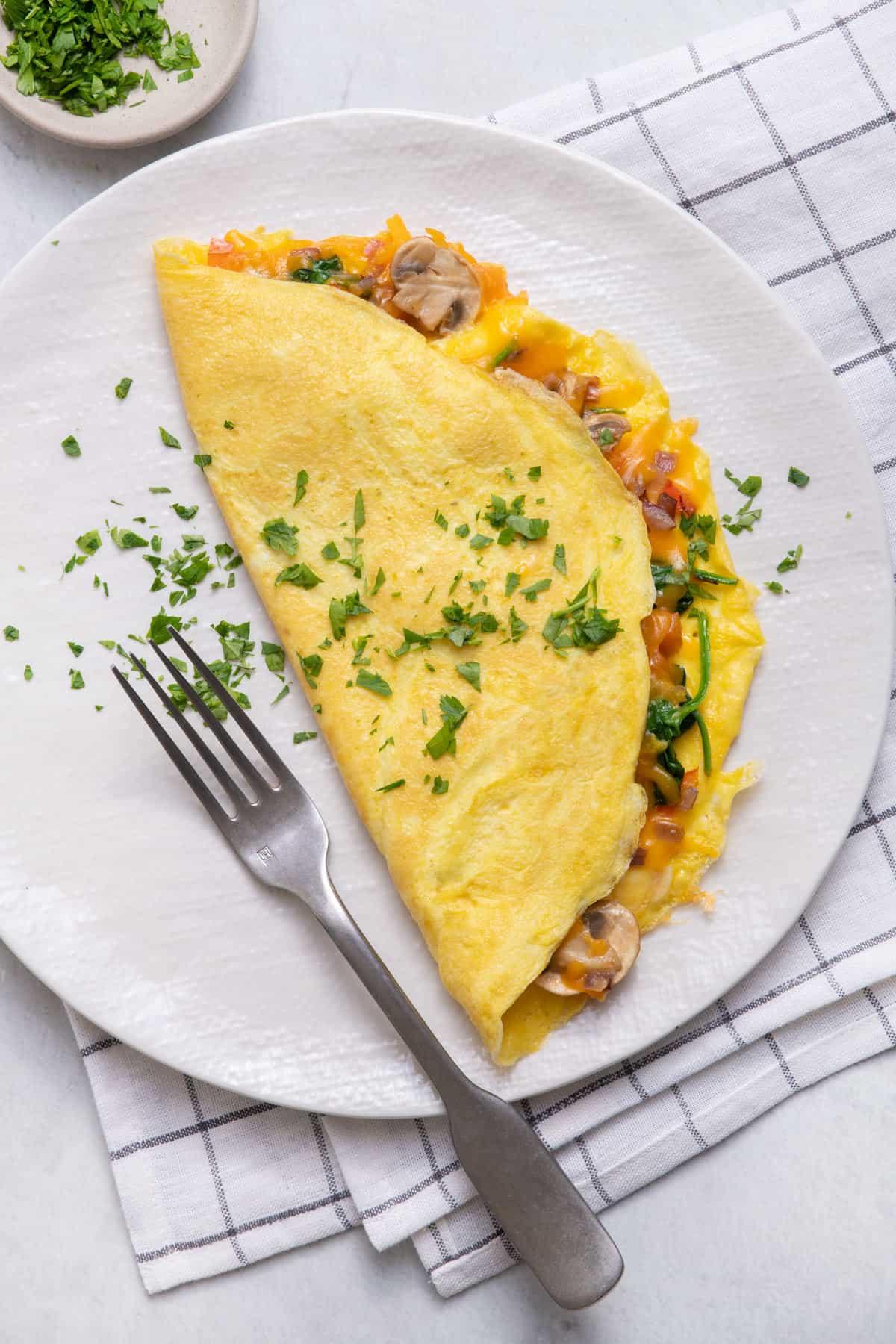 A delicious roasted vegetable and cheese omelet on a plate