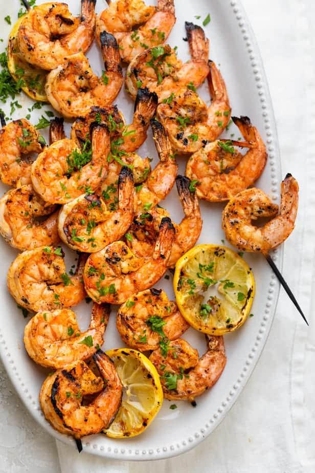 Various grilled shrimp skewers on a grill