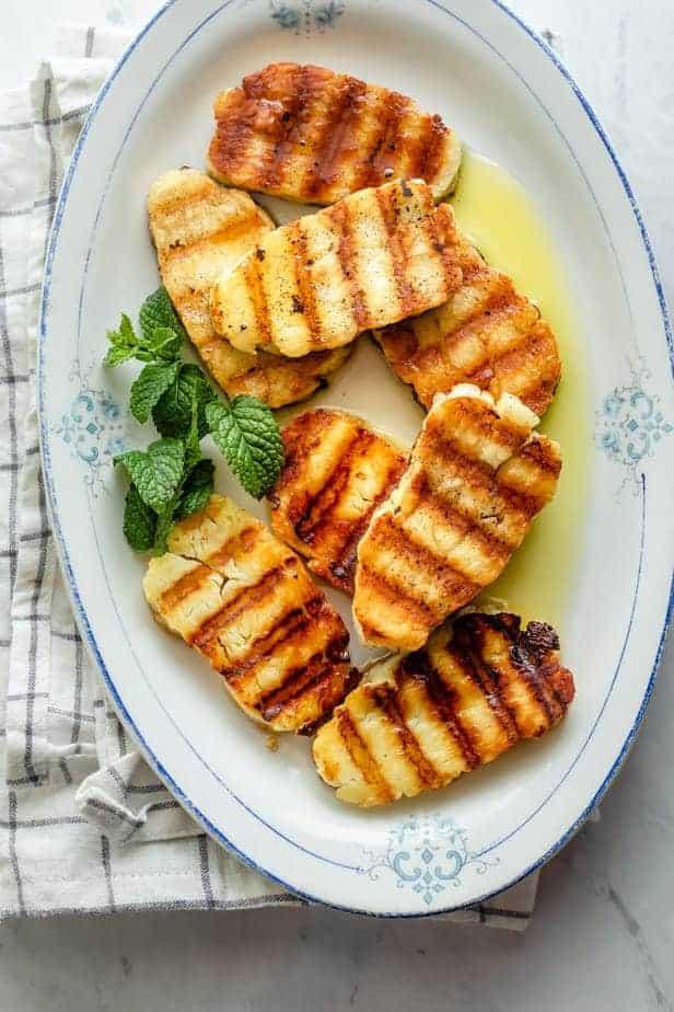 A close up shot of a beautifully grilled halloumi cheese slice with grill marks