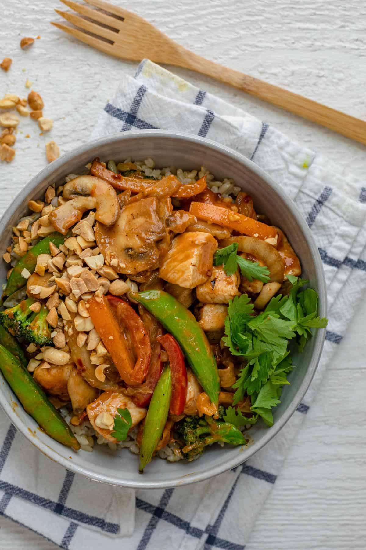peanut butter chicken stir-fry in a wok