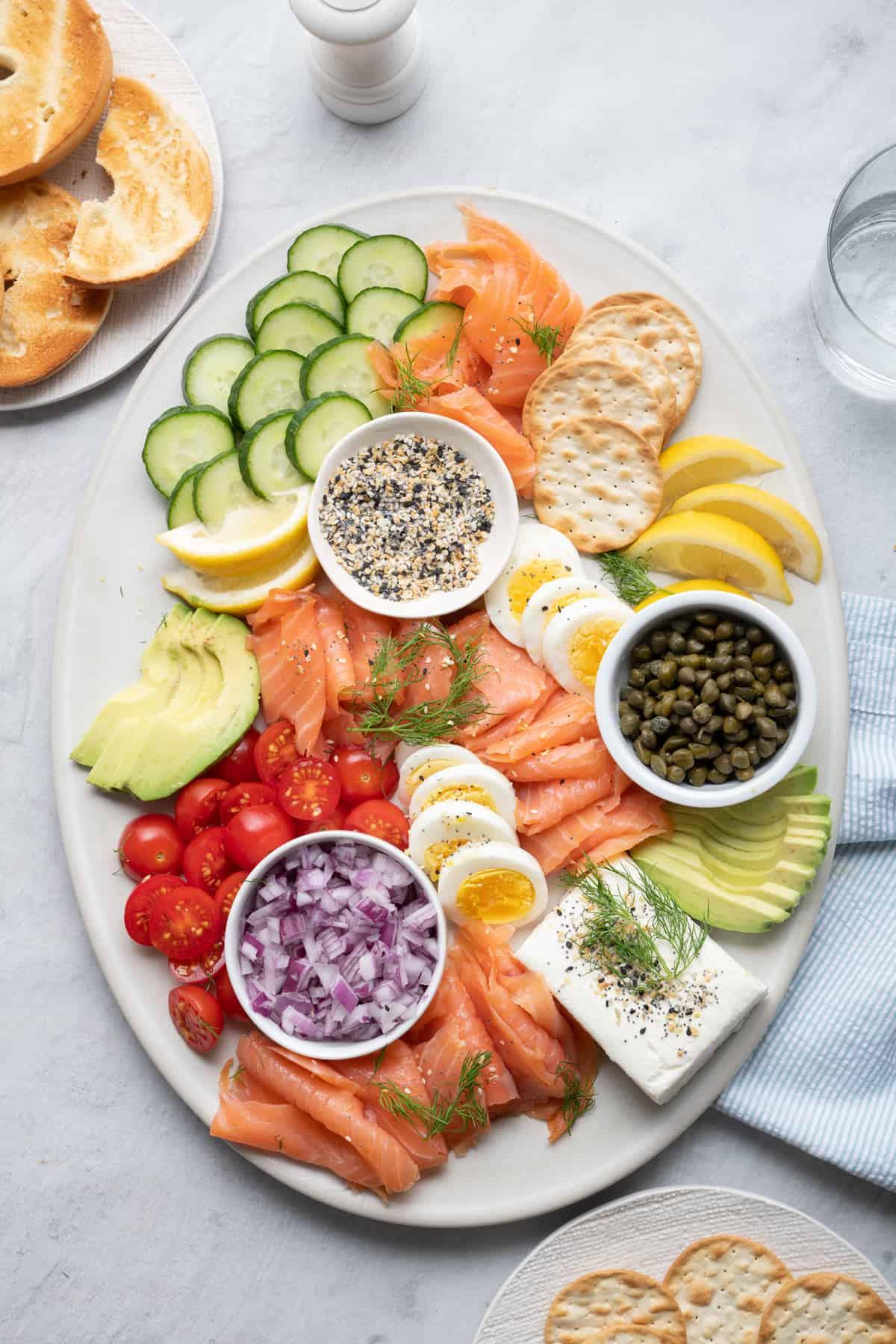 A beautifully arranged platter of smoked salmon and cucumber sandwiches