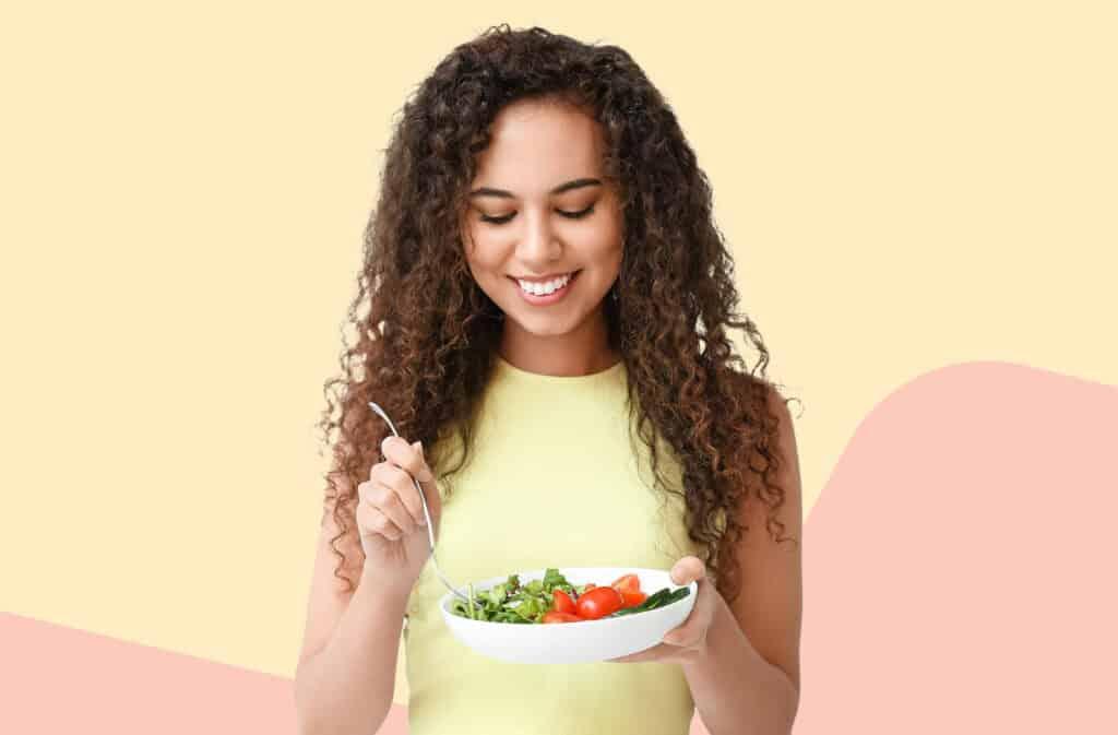 a person smiling while holding a bowl of Green Apple & Ginger Tzatziki