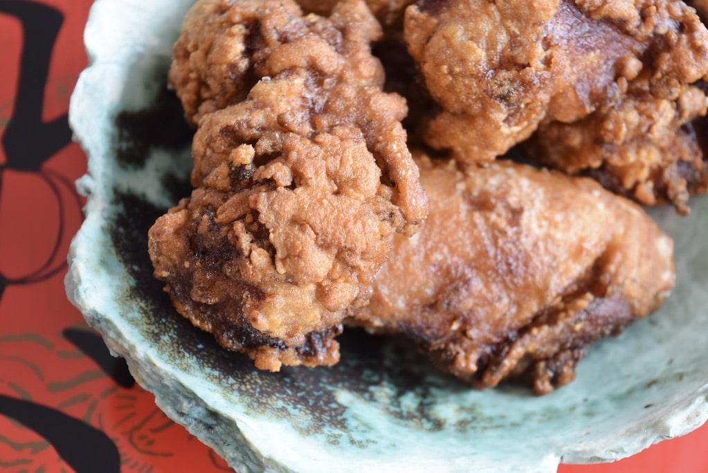 Close-up of a crispy Hawaiian luau fried chicken piece