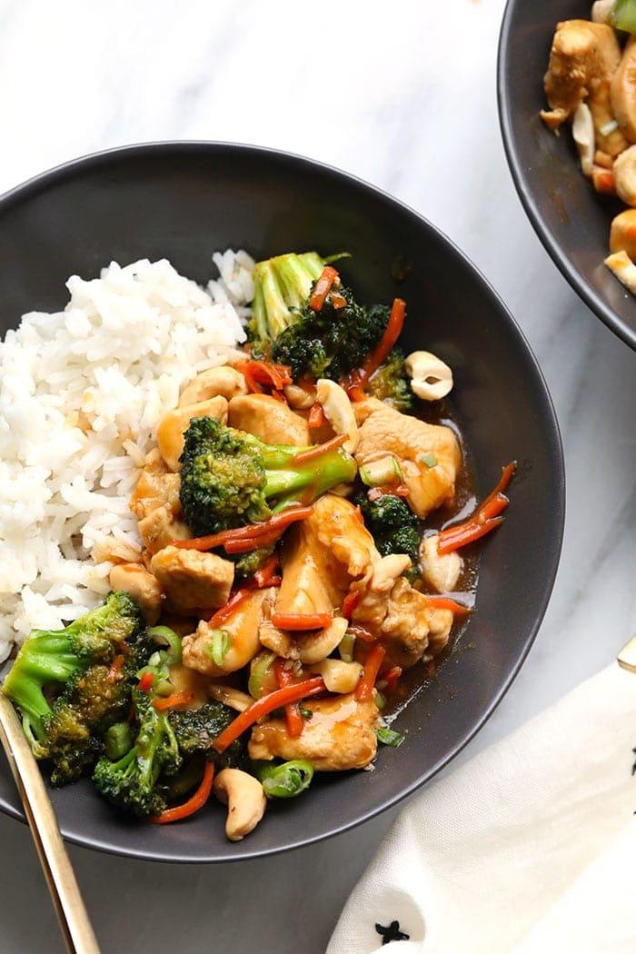 A person enjoying a chicken stir-fry protein bowl