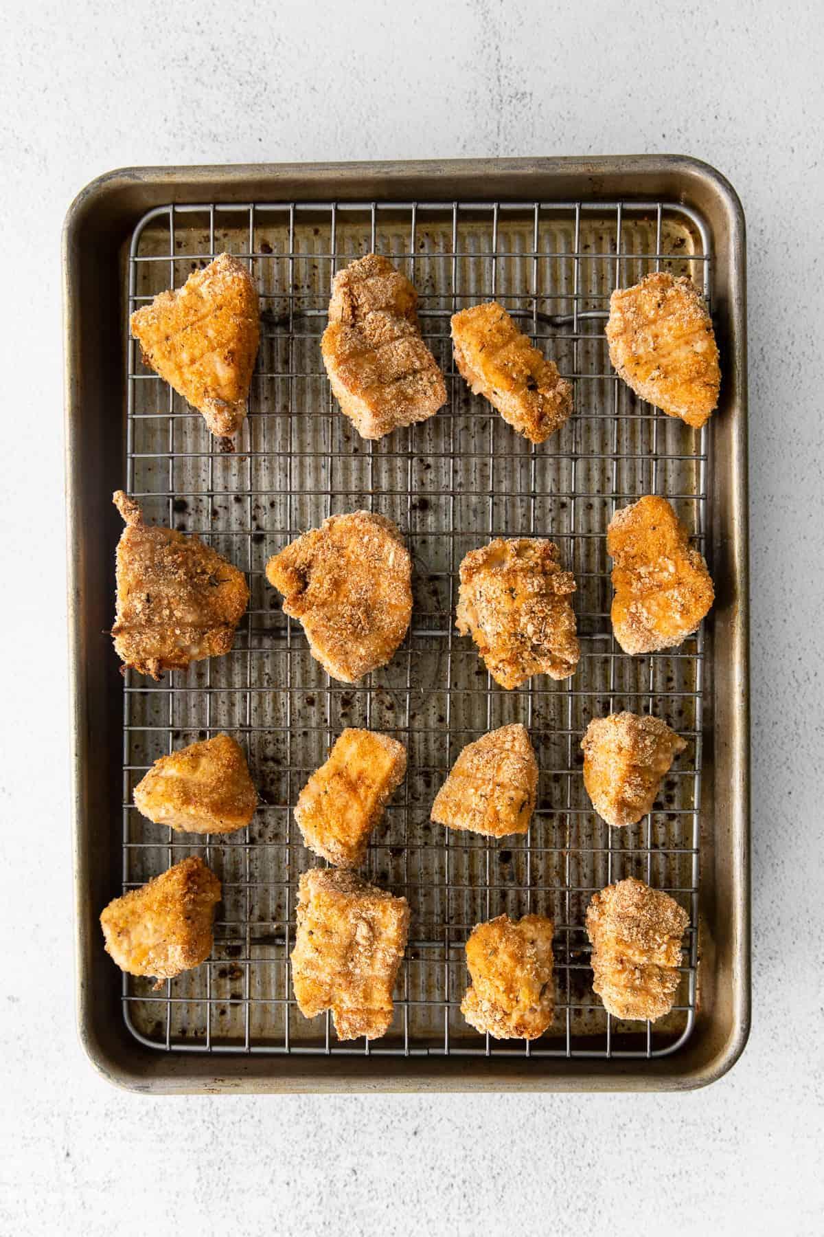 Close-up shot of golden-brown cherry nuggets on a baking sheet