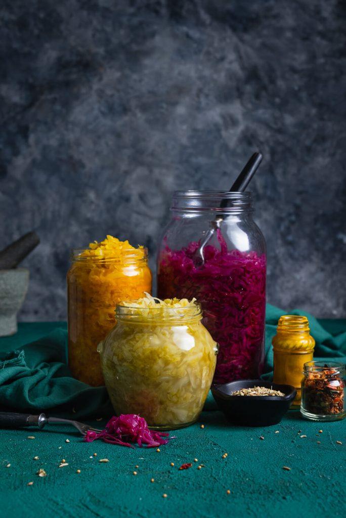 Close-up shot of homemade sauerkraut and apricot jam in a jar