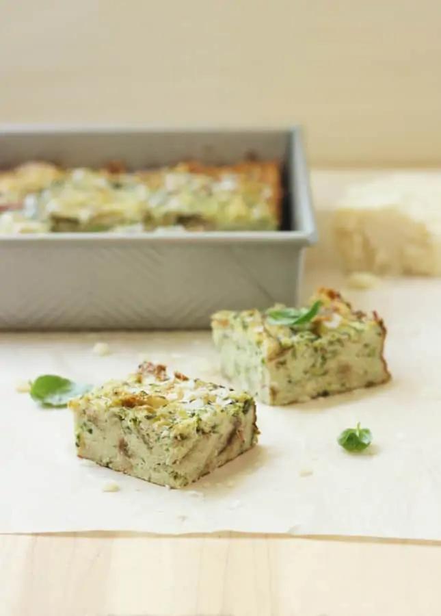 A close-up of the bread pudding mixture being spooned into a zucchini