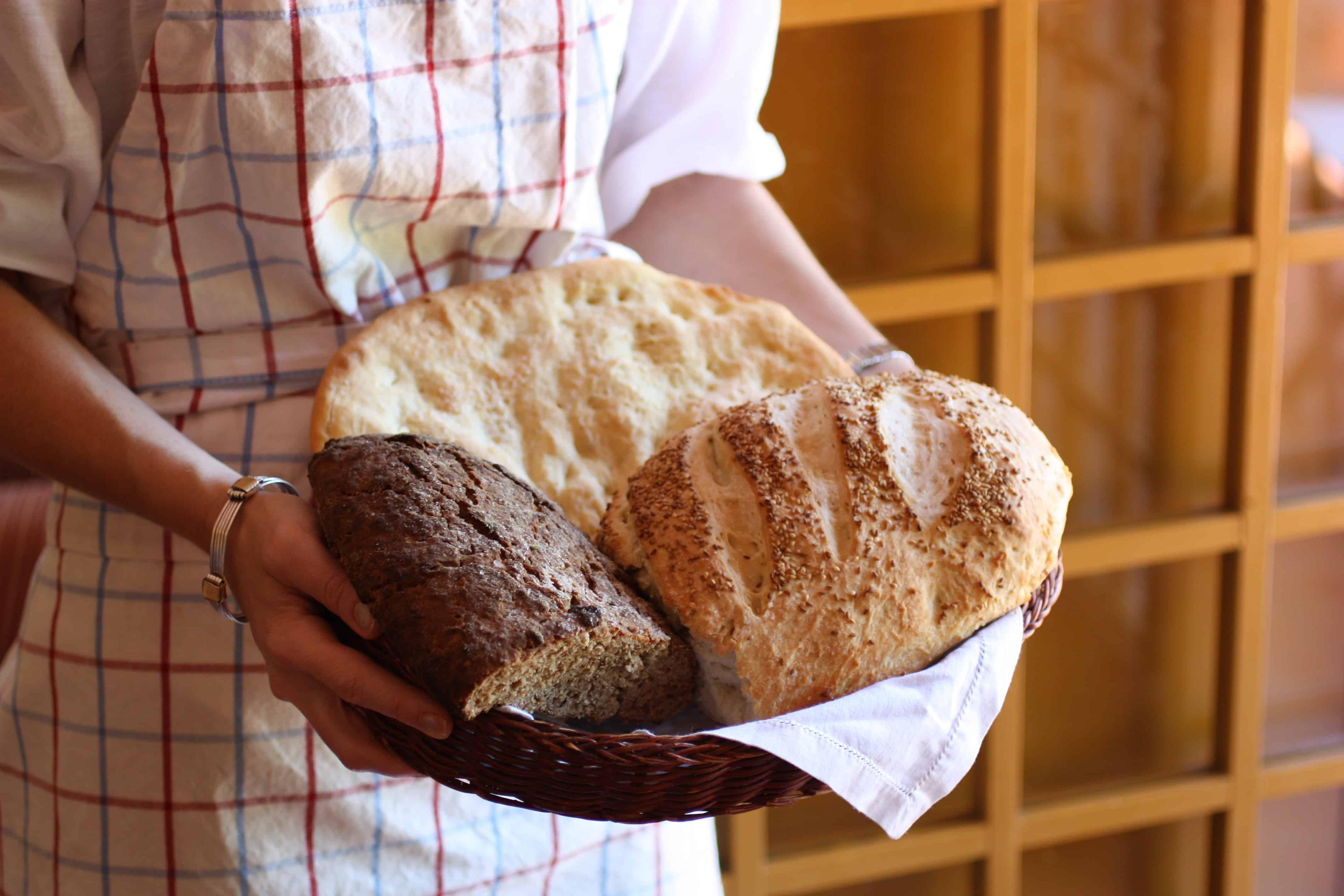 golden-brown florentine bread loaf on a rustic wooden table