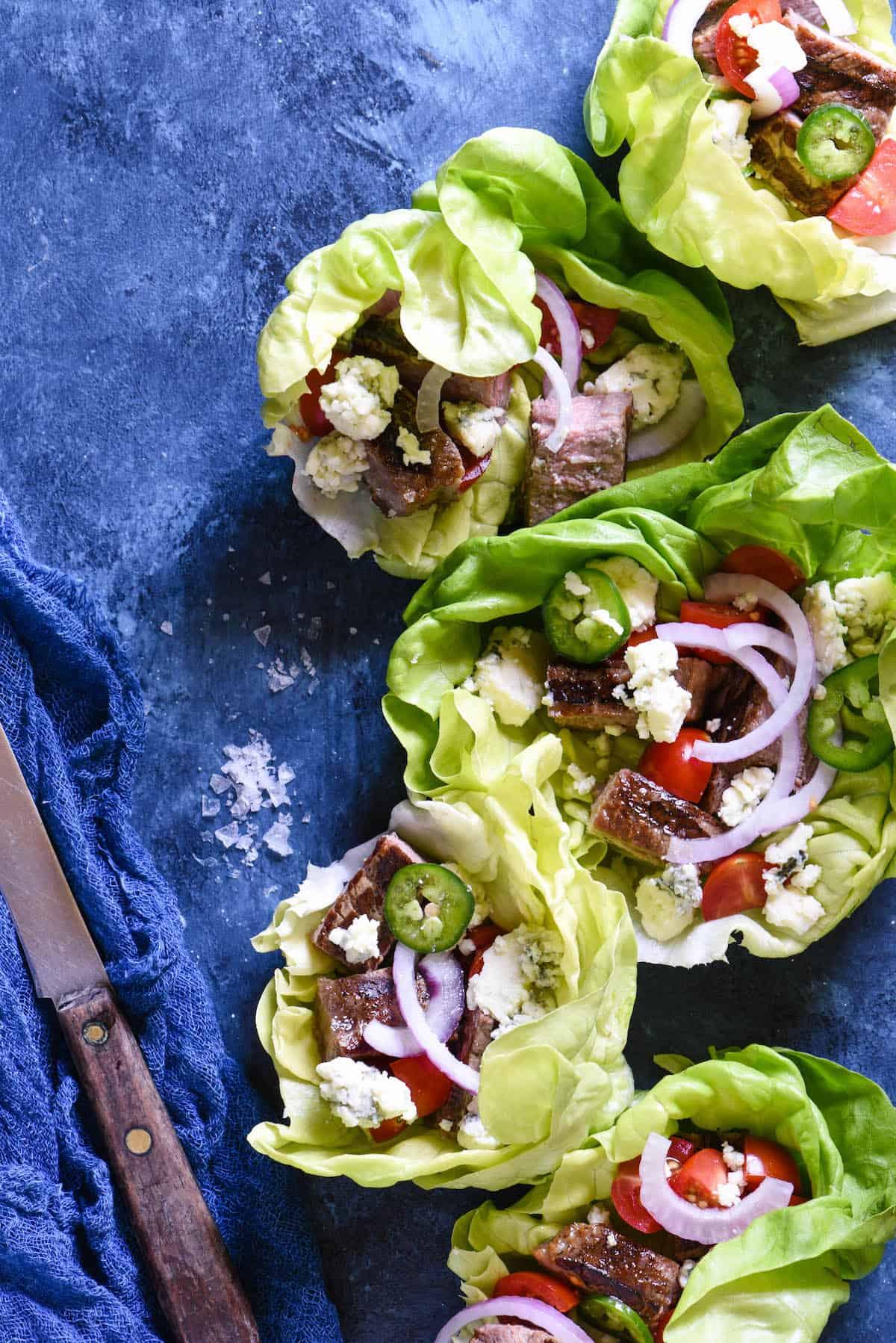 Close-up of juicy steak and blue cheese in lettuce wraps