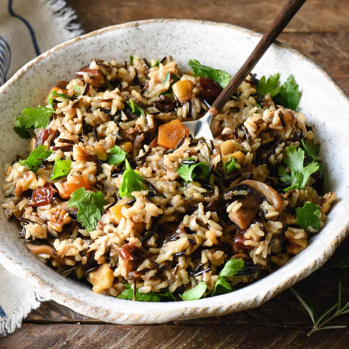 A family enjoying a Thanksgiving meal with the rice pilaf as a centerpiece