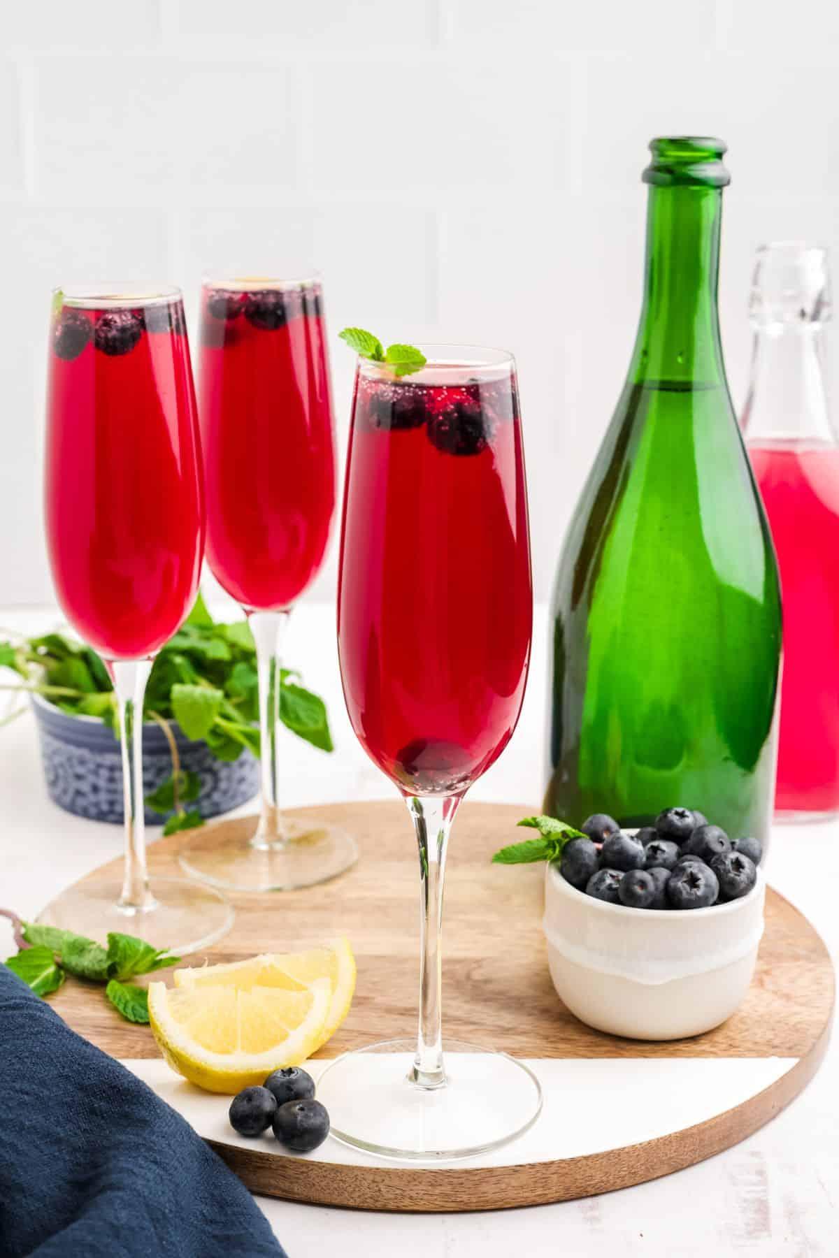 glasses of cilantro blueberry mimosa on a brunch table