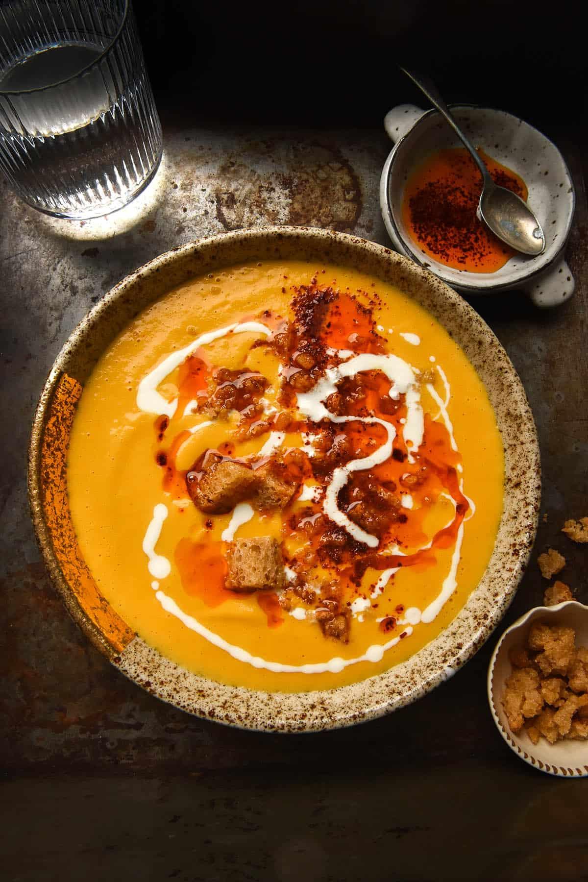 aerial shot of a steaming bowl of pumpkin soup