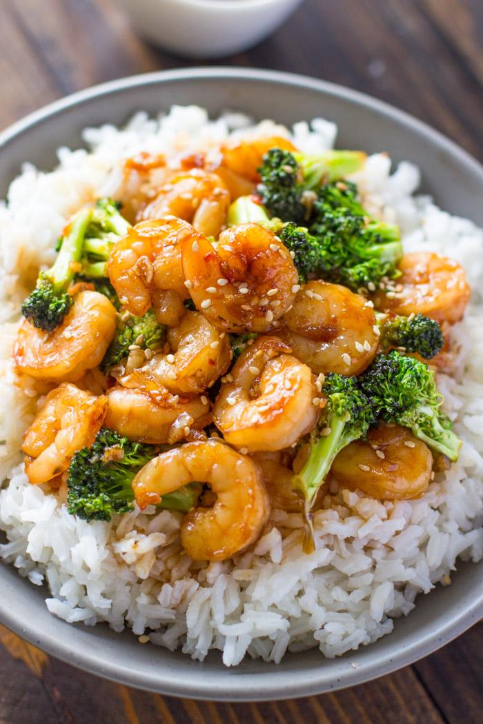 Cooked honey garlic shrimp served with white rice and steamed broccoli