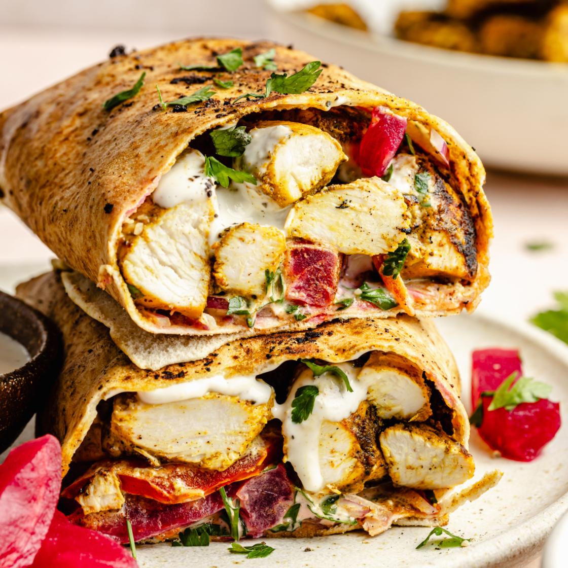 Chicken shawarma wraps laid out, ready to be eaten