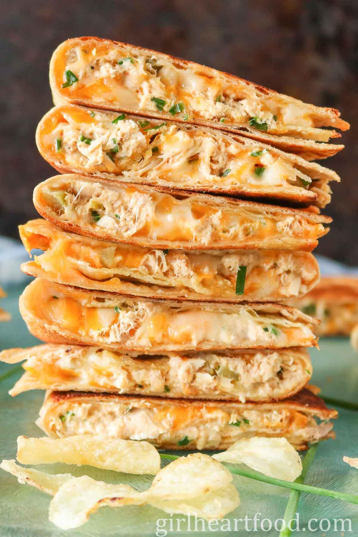 A stack of freshly made tuna quesadillas cut into wedges