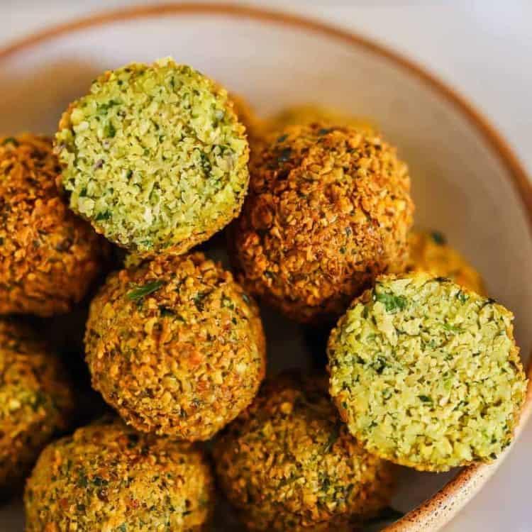 crispy falafel balls with creamy avocado crema