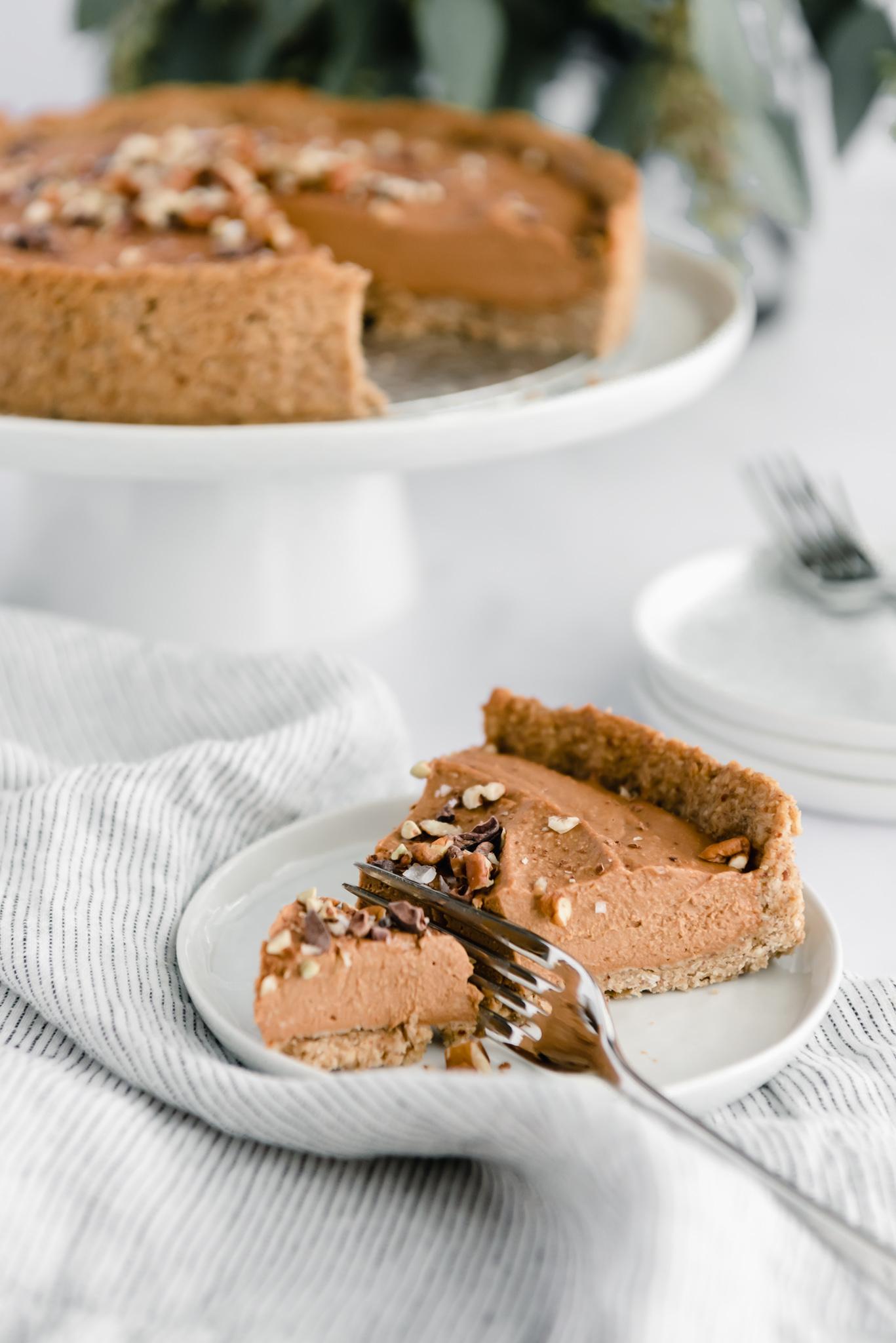 Close-up shot of a mug of sweet potato pie hot chocolate with toasted pecans