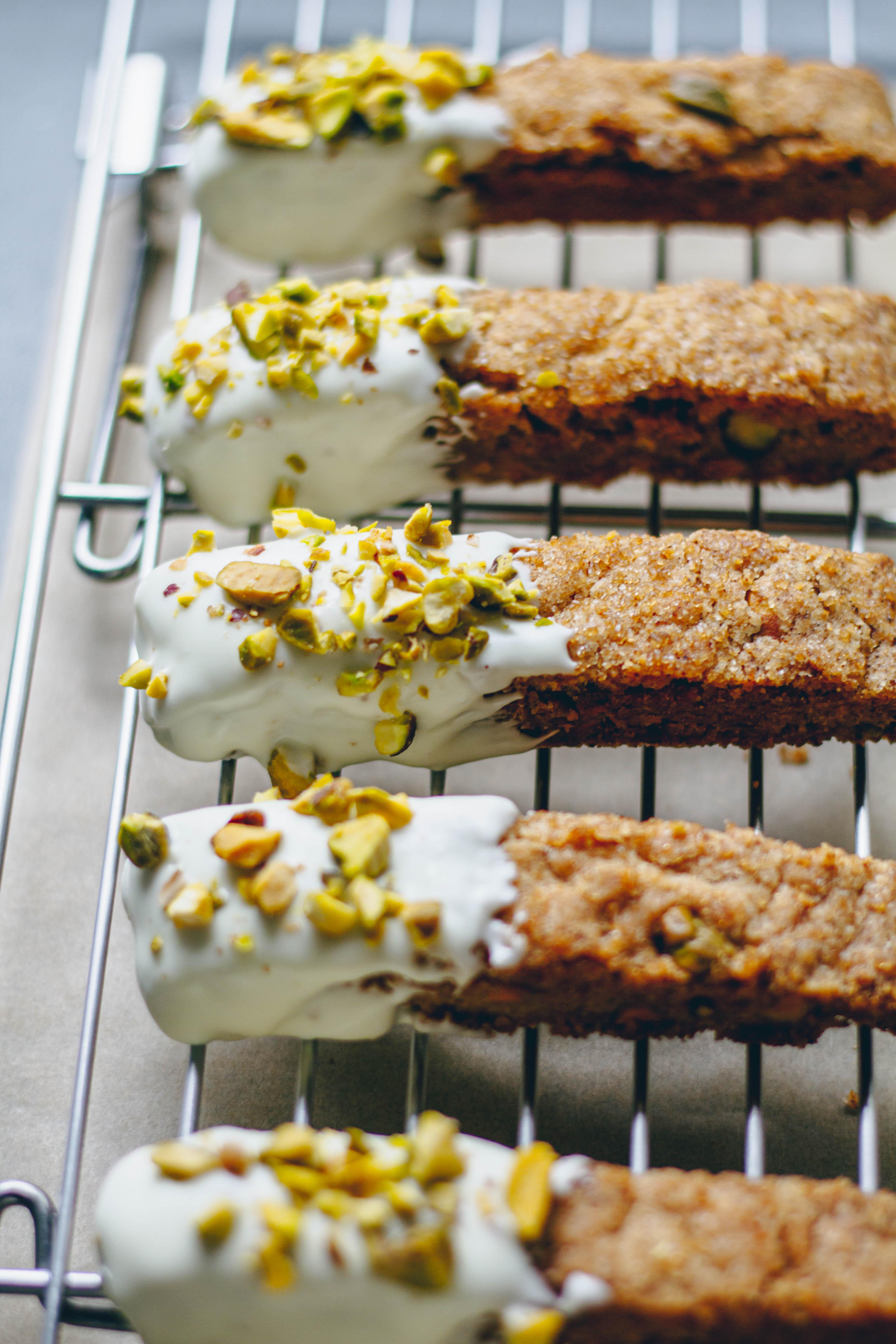 delicious plantain and pistachio biscotti on a cooling rack
