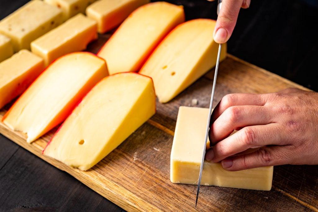Smoked Edam Cheese being sliced