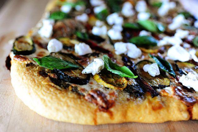 grilled vegetable pizza with asiago cheese on a grill