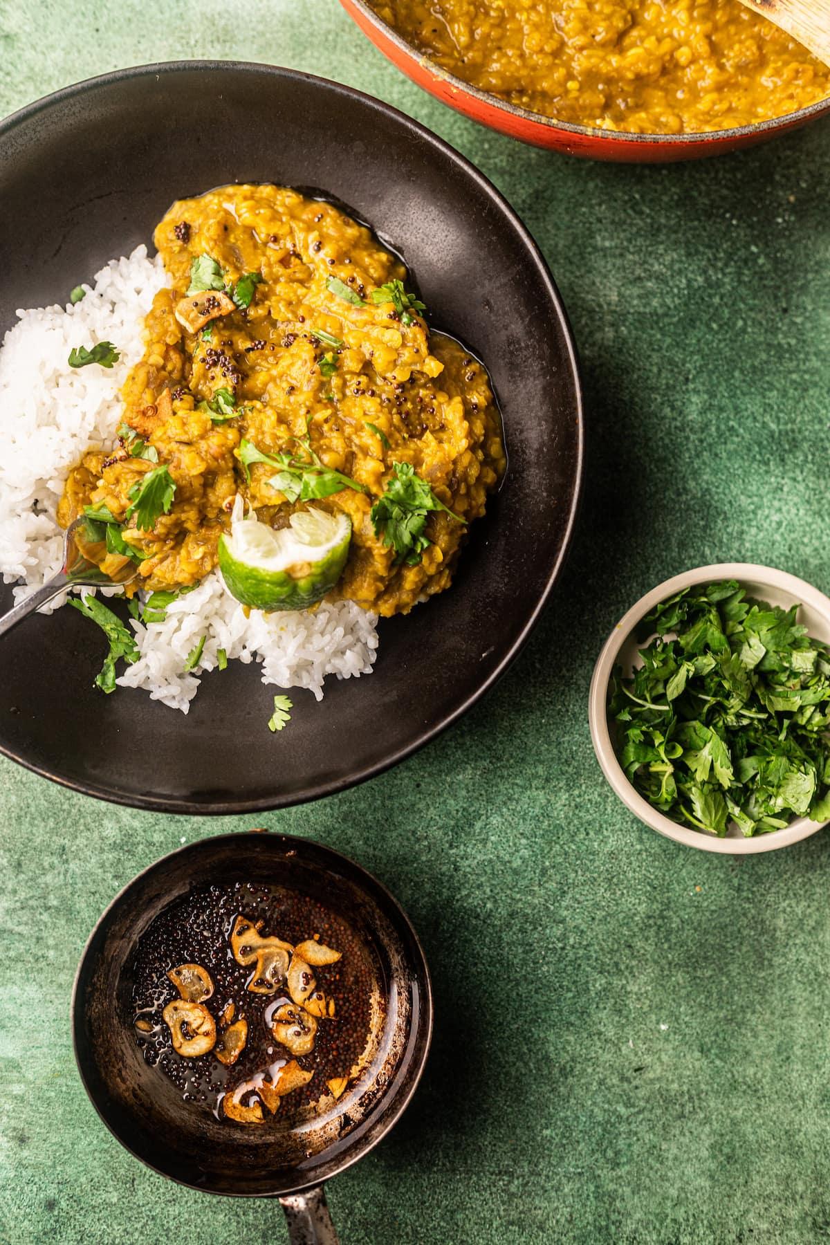 Aromatic bowl of roasted garlic and cilantro dal with rice