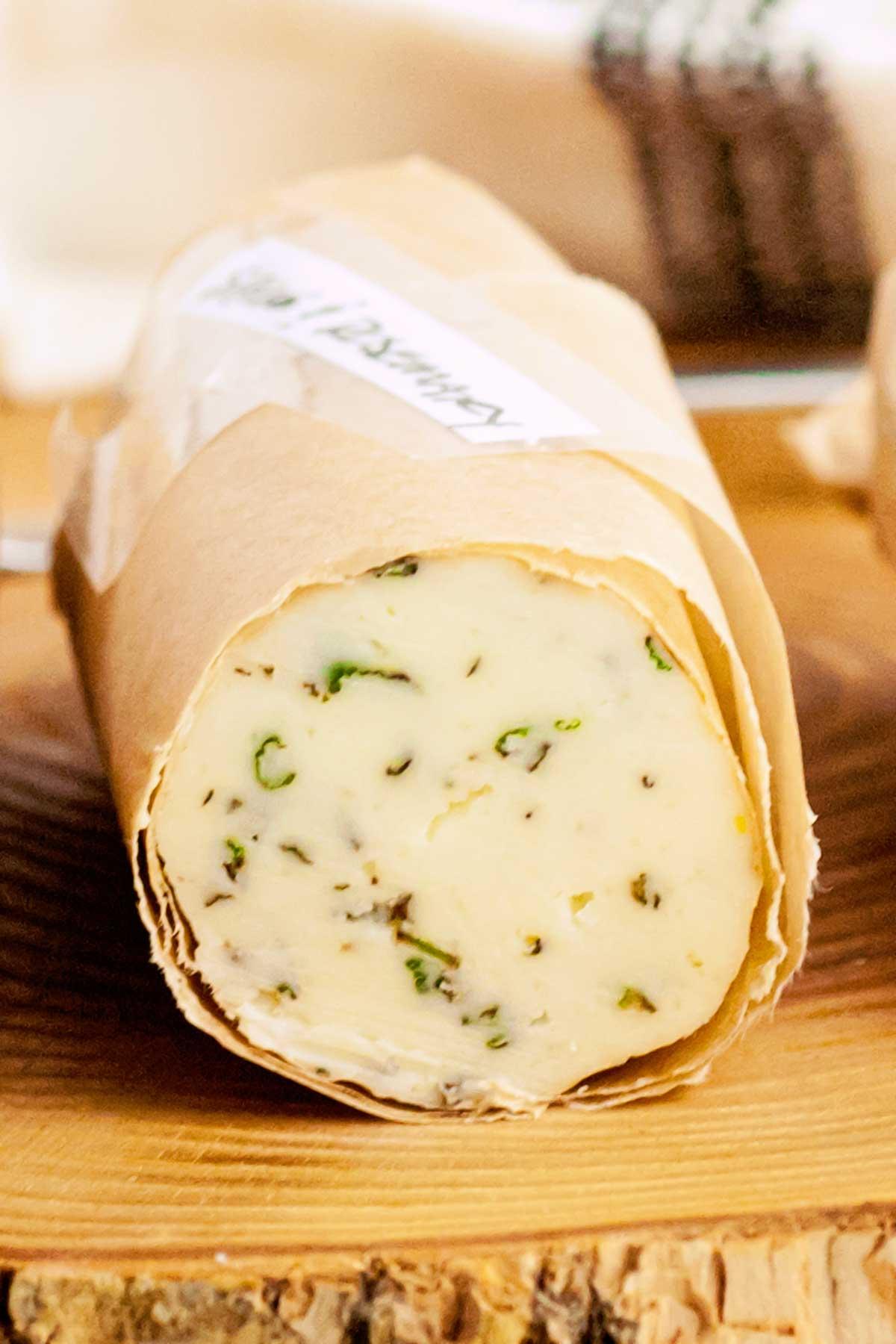 Close-up shot of a pat of rosemary and sage butter on a baking sheet