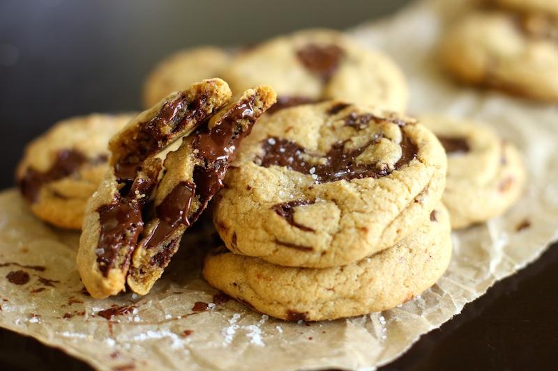Extreme close-up of a warm, gooey chocolate chip cookie with melted chocolate