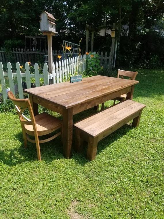 A rustic wooden table set with a stack of sauerkraut and caraway seed flatbreads