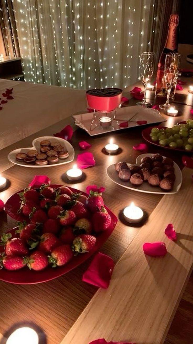 romantic anniversary setting with chocolate fondue and candles