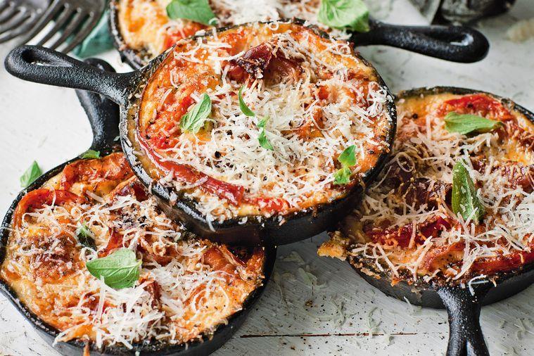 A rustic looking Prosciutto and Parmesan Frittata in a cast iron skillet