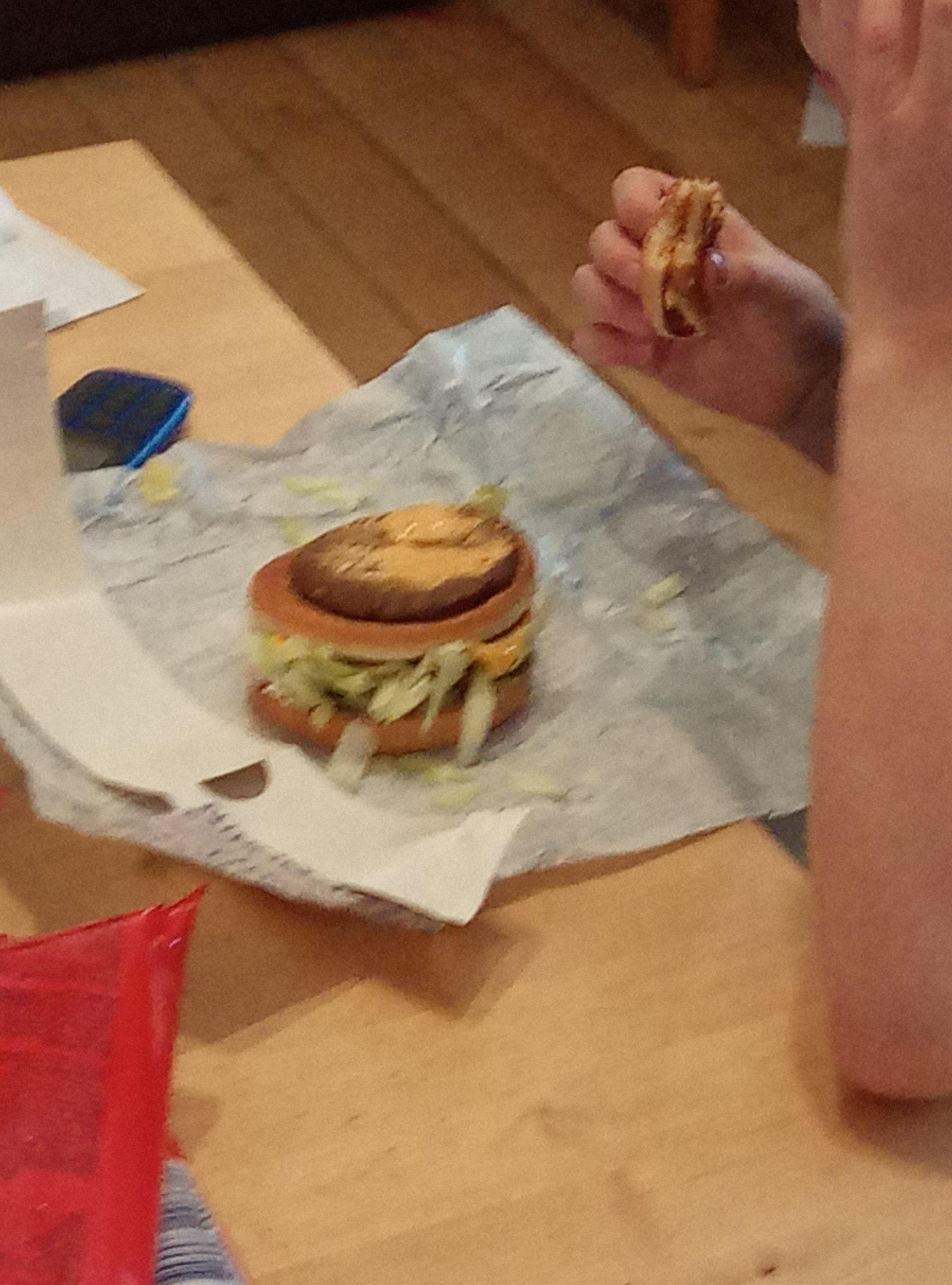 the yurei yearn burger cut in half to show its layers