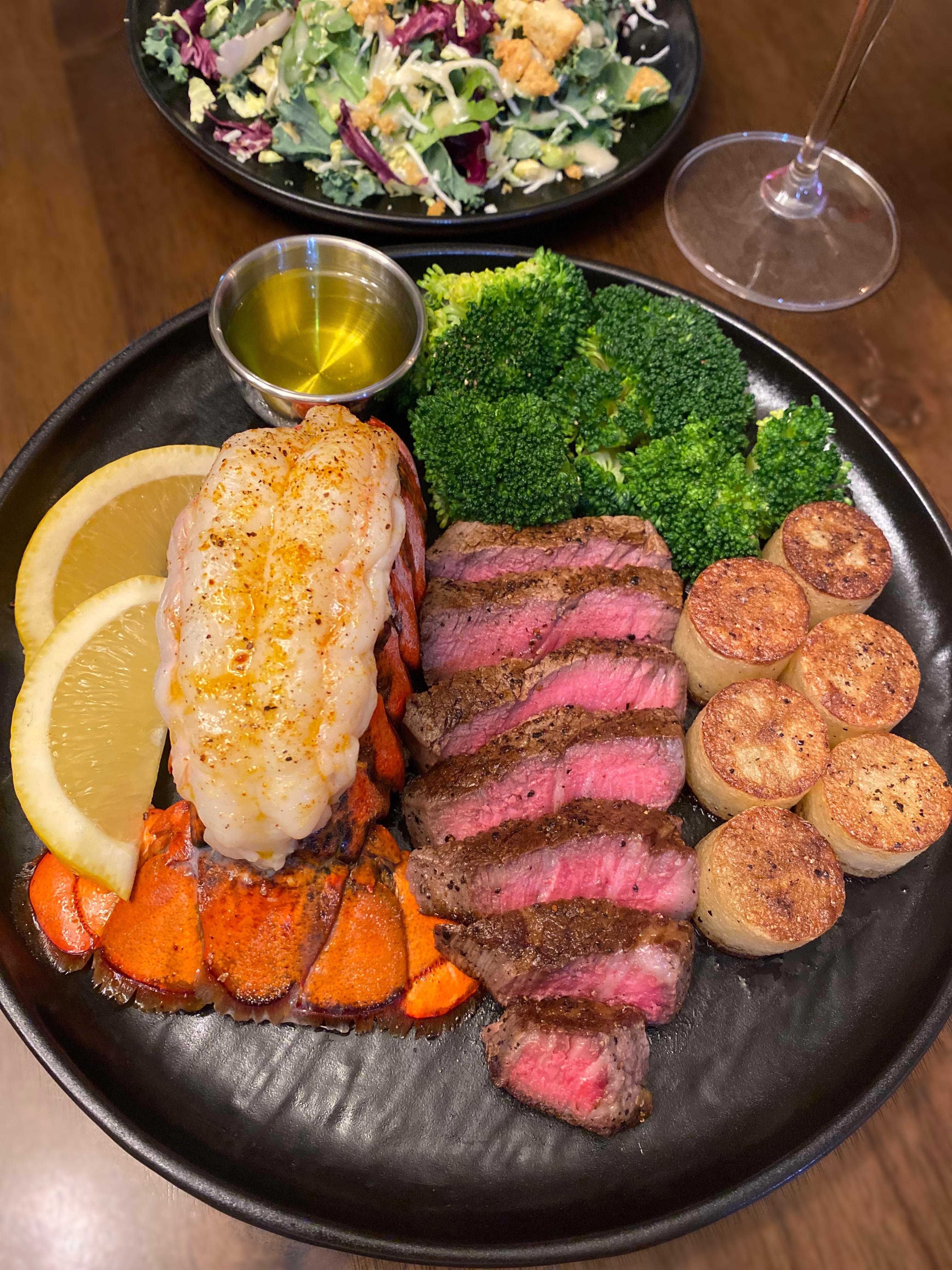 A beautifully plated dish of Spiced Lobster Tail with Anniversary Toast