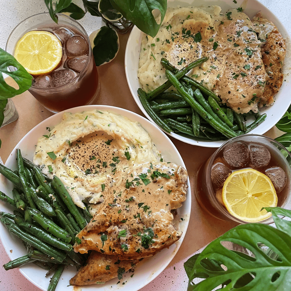 apple Dijon chicken plated with a side of mashed potatoes and green beans