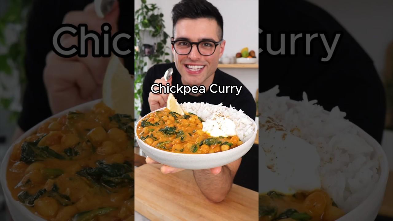A person serving a bowl of chickpea curry