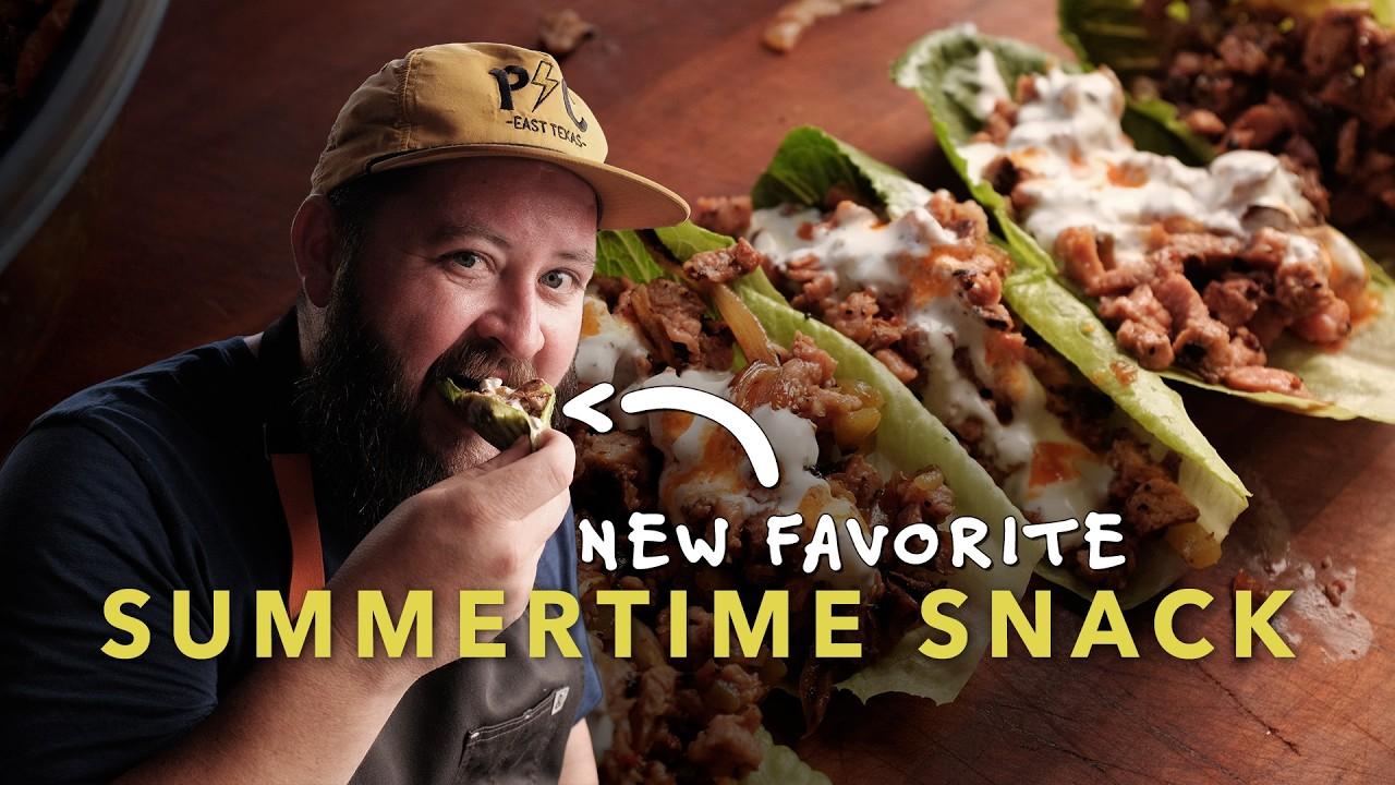 A person enjoying a steak and blue cheese lettuce wrap