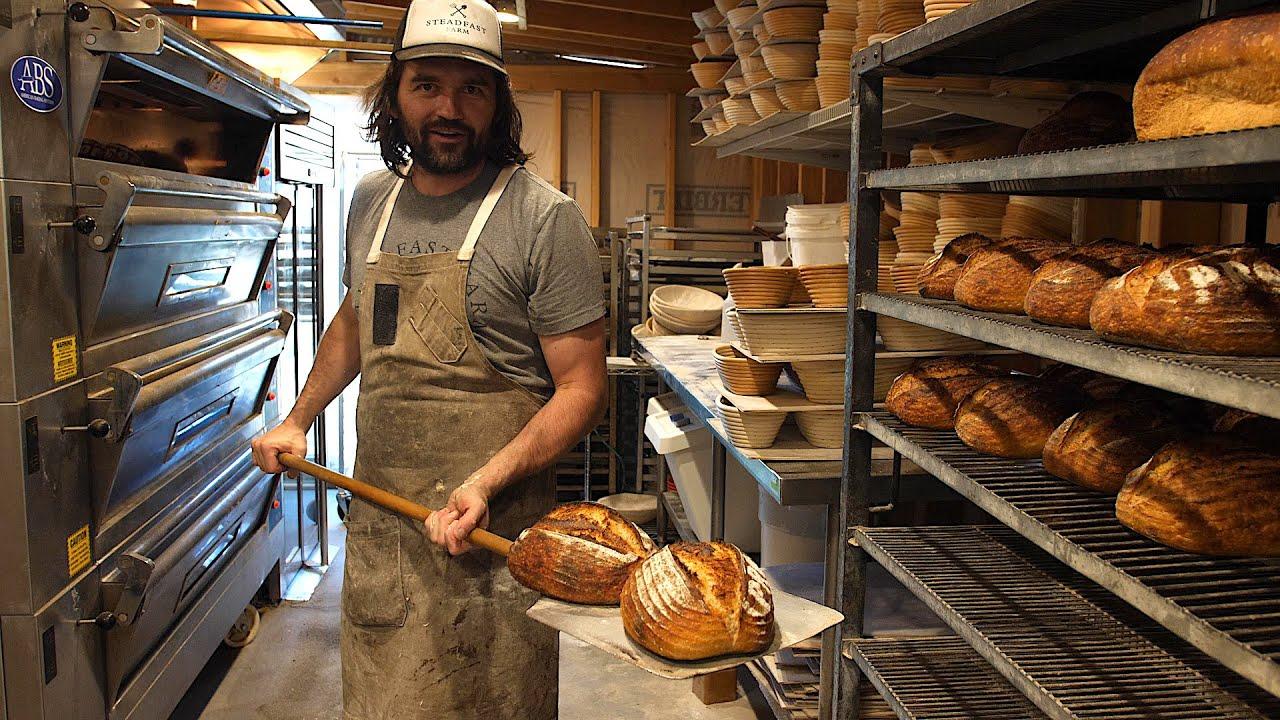 A rustic kitchen scene showing various stages of sourdough bread making