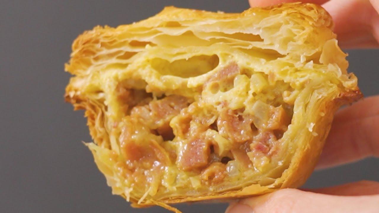 close up shot of bobotie pot pie being sliced open