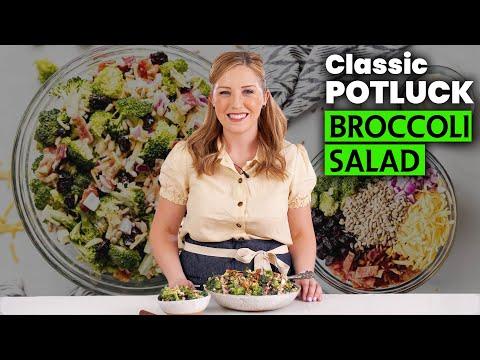A person serving a bowl of broccoli cheddar salad at a potluck